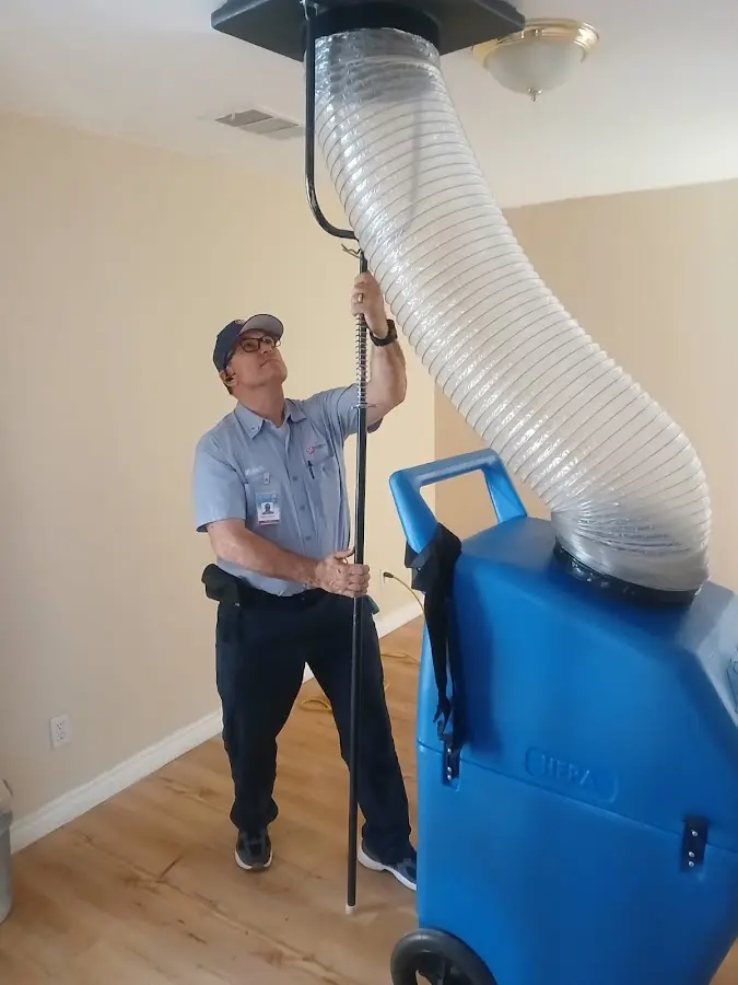Furnace Tune-Up technician using HEPA equipment in Cottonwood Heights